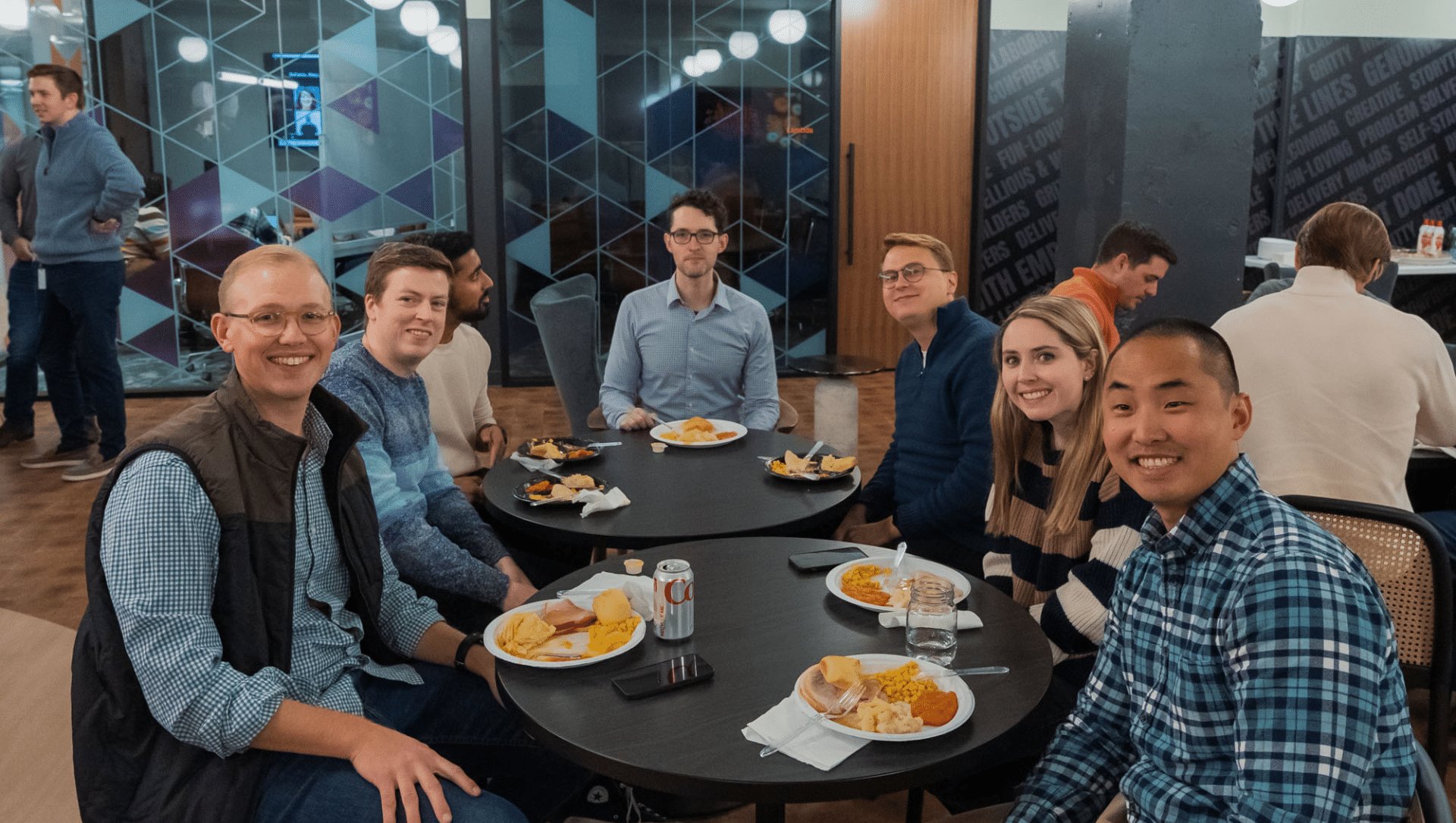 group smiling at thanksgiving table