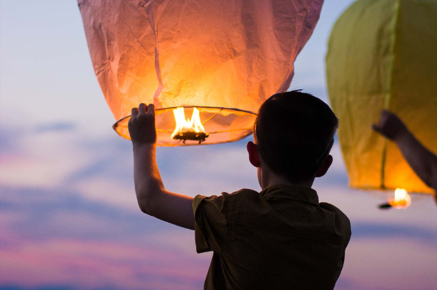 boy lifting paper lantern artificial intelligence consulting