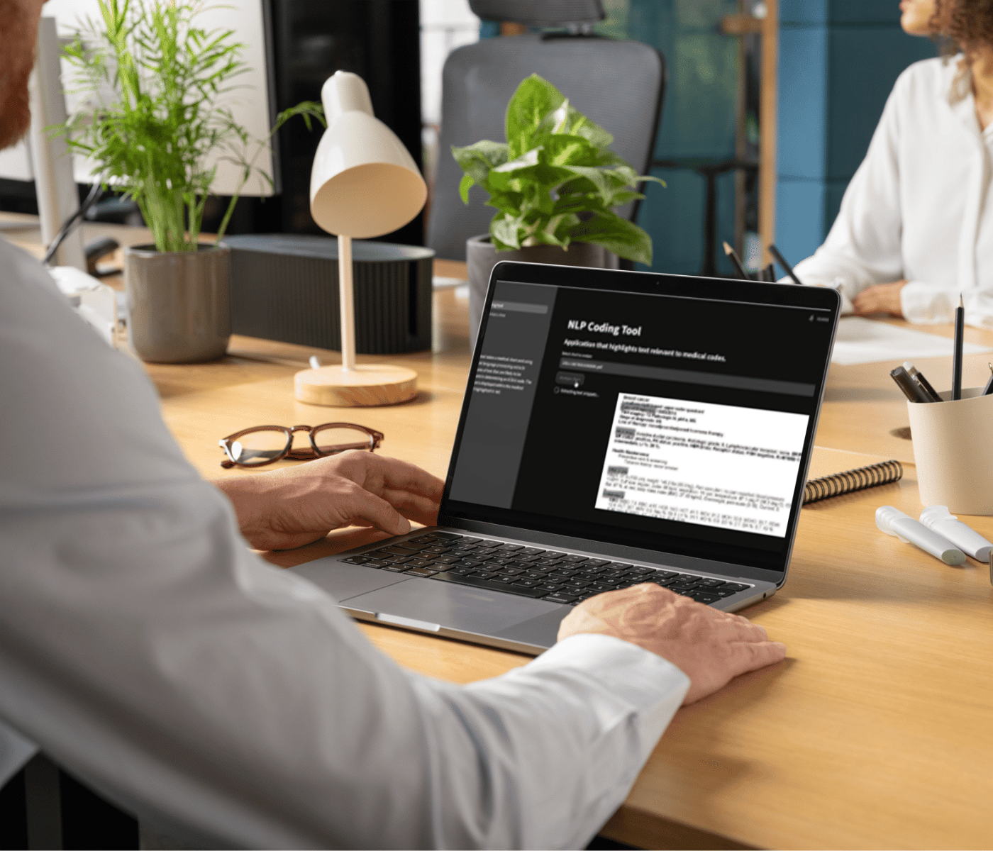 man using NLP coding tool for AI risk adjustment in healthcare