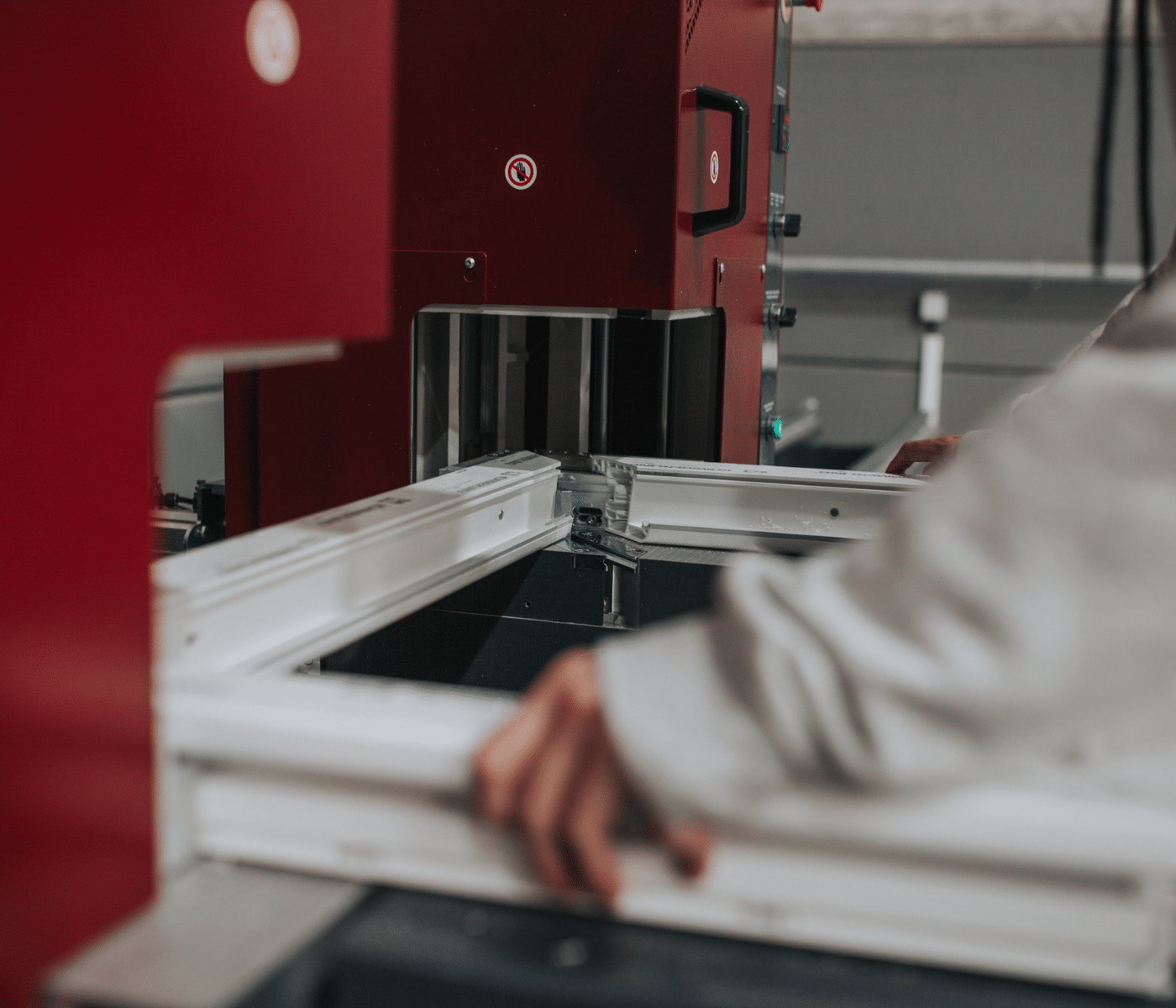 cropped hands of a worker making window frame AI Predictive Maintenance in Manufacturing