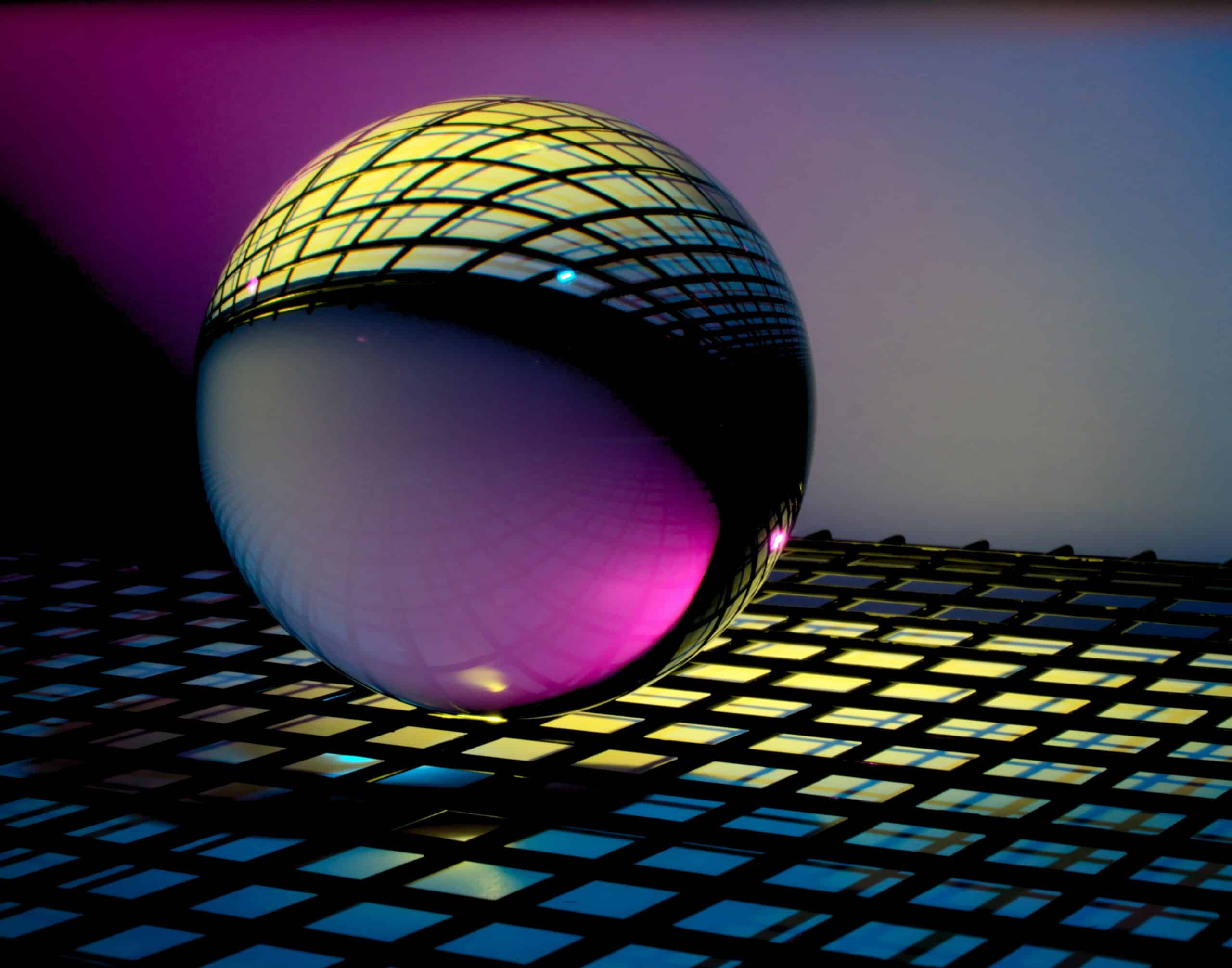 man smiling in blue pink light